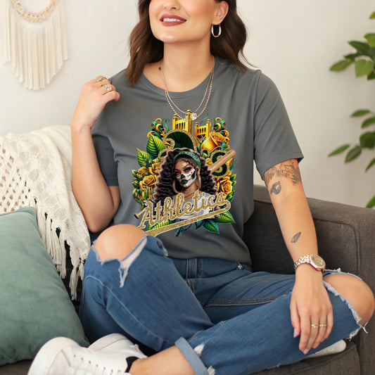 Woman wearing a gray t-shirt with a dia de los muertos Athletics design