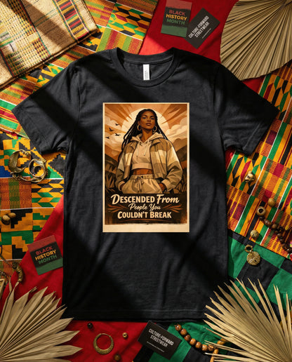 Black t-shirt with a graphic design on a colorful fabric background