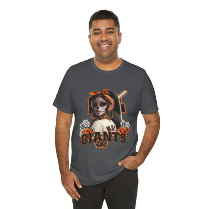 Man wearing a gray t-shirt with a sf giants dia de los muertos design on a white background