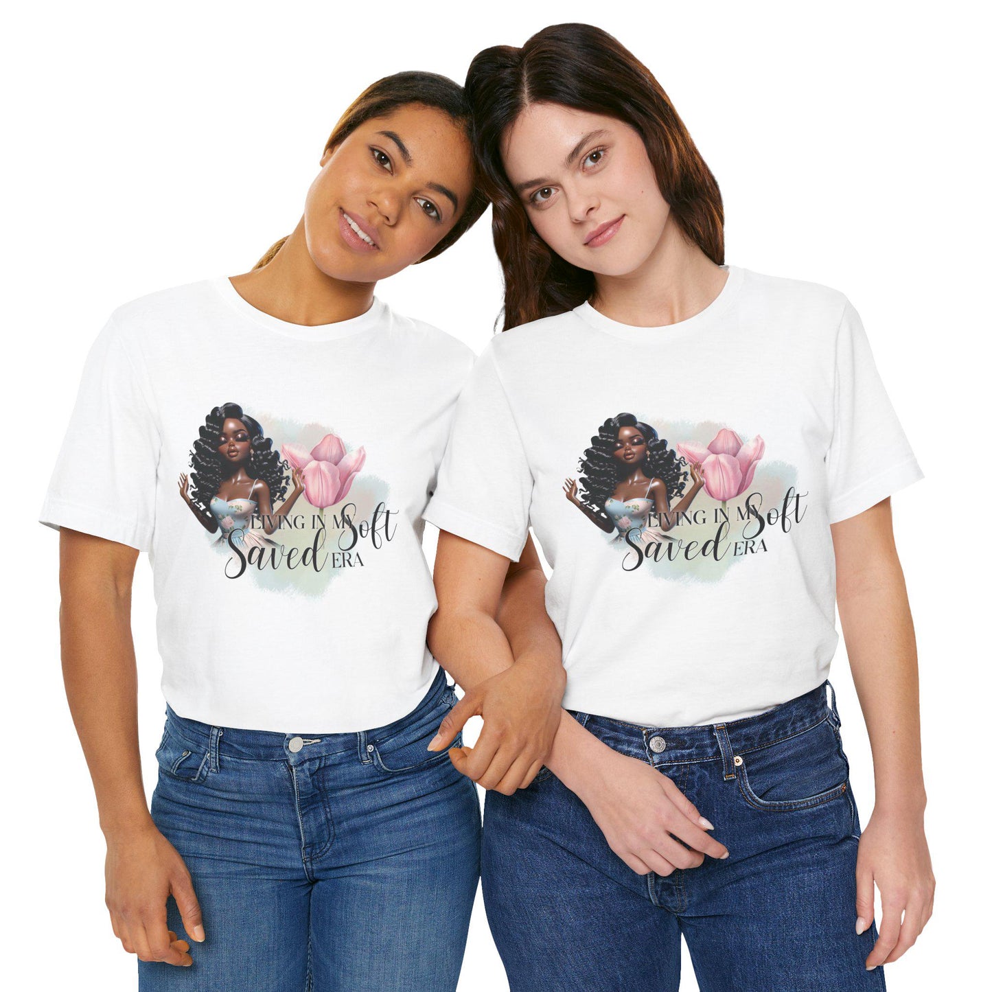 Two women wearing white t-shirts with a graphic design and text, standing close together on a white background.